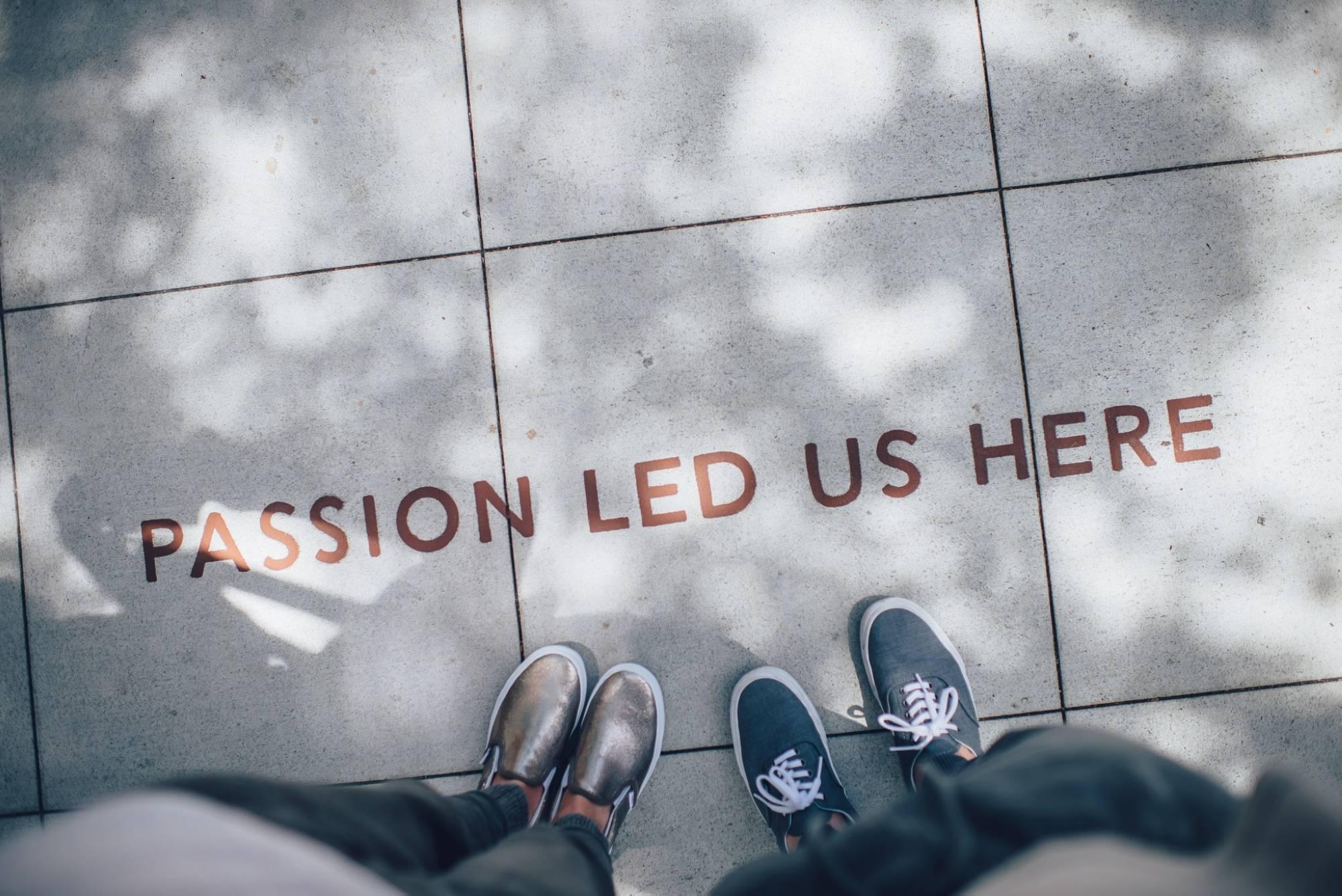 Pavement with words "Passion Led Us Here"